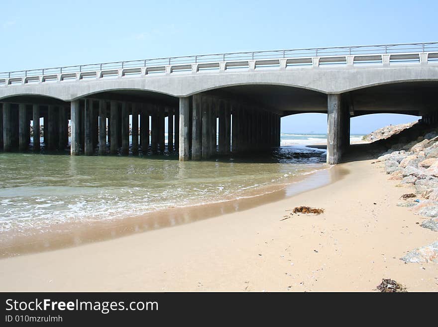 Bridge with ocean water flowing through. Bridge with ocean water flowing through.