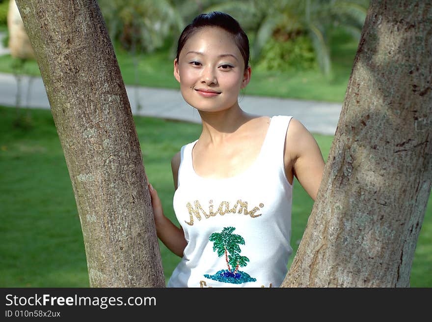 Chinese Girl Between Branches