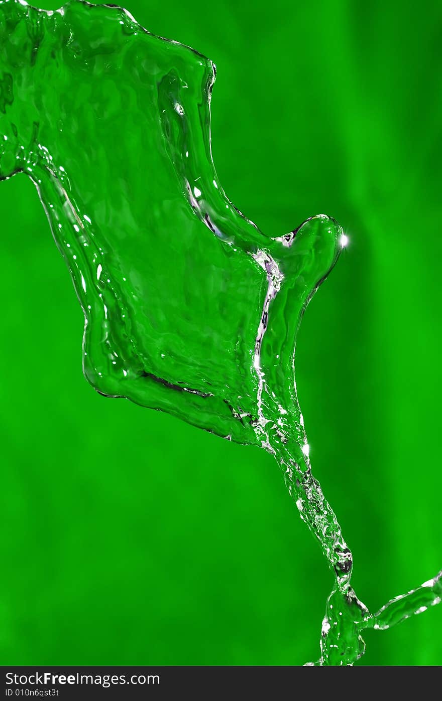 Flowing water stream over colored background