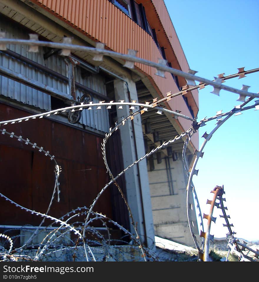 View on Bjelasnica downhill start house through barbed wire remains from Bosnian war 1992-1995, Bosnia and Herzegovina