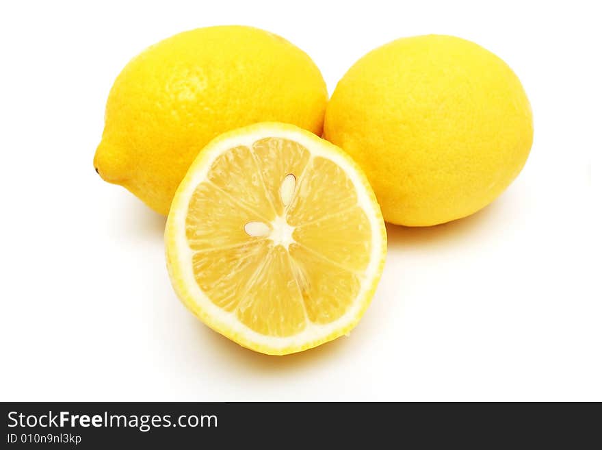 Closeup of an half lemon and others on white background. Closeup of an half lemon and others on white background.