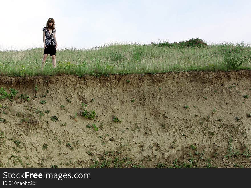 A beautiful girl walking on the field