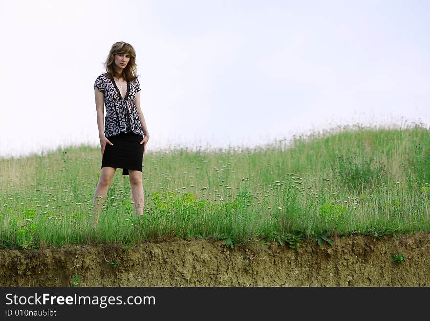 A beautiful girl walking on the field