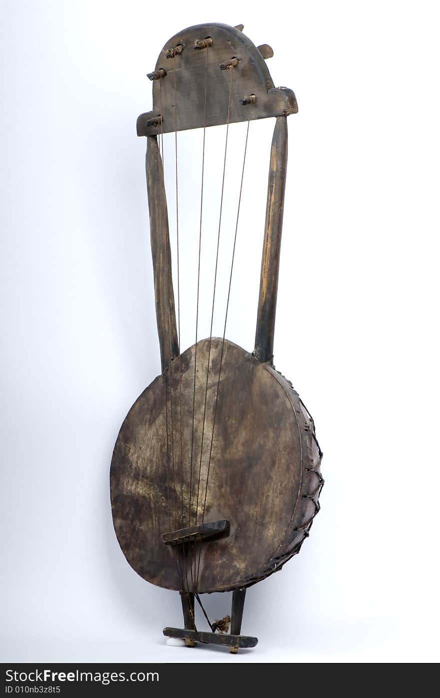 A banjo hand crafted from raw materials, typically found in countries of central and southern africa, usually hand made by shepherds, and used by them to to create a familiar tune for the animals to follow. A banjo hand crafted from raw materials, typically found in countries of central and southern africa, usually hand made by shepherds, and used by them to to create a familiar tune for the animals to follow.