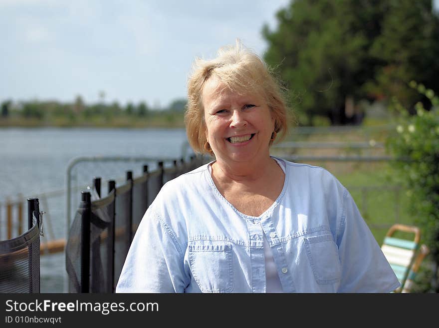 Photo of a happy senior by the waterfront