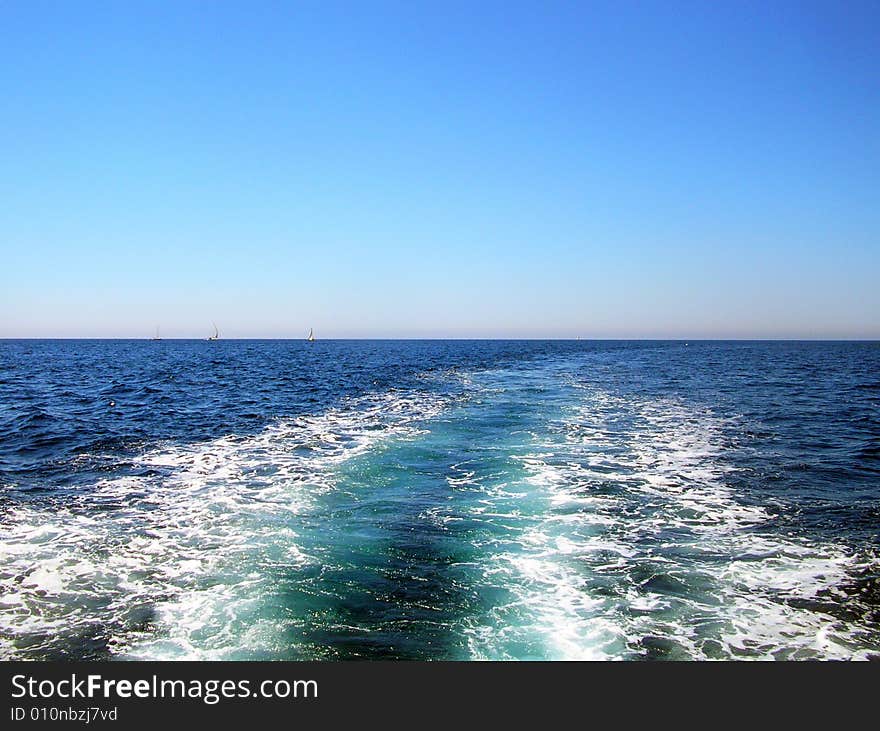 The blue sea in Italy - Sardinia. View from the ship. The blue sea in Italy - Sardinia. View from the ship