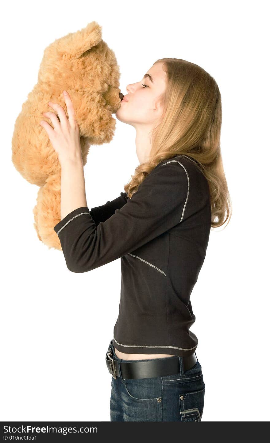 Young girl hugging a Teddy bear, isolated. Young girl hugging a Teddy bear, isolated