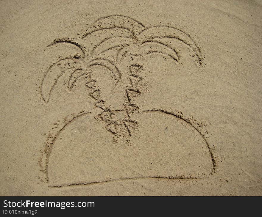 View of figures palm tree on sand