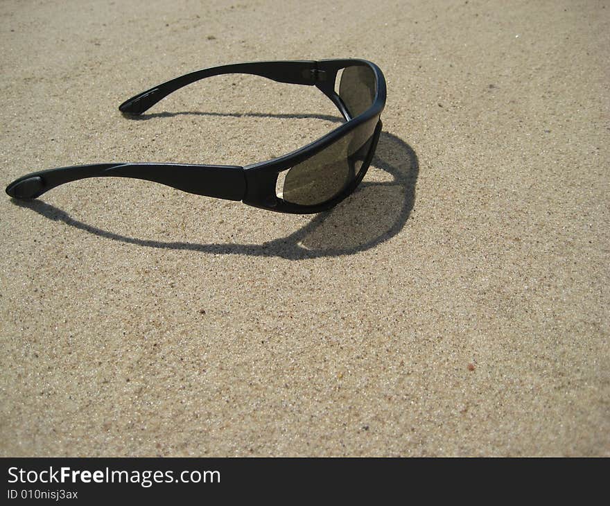 Solar Glasses On Sand