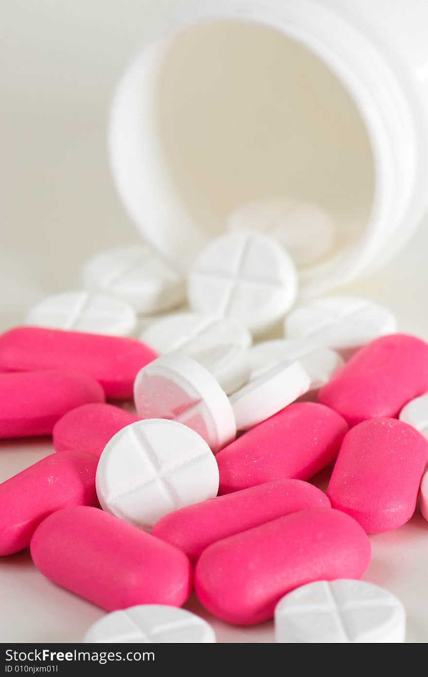 Close up of pink and white pills. Close up of pink and white pills