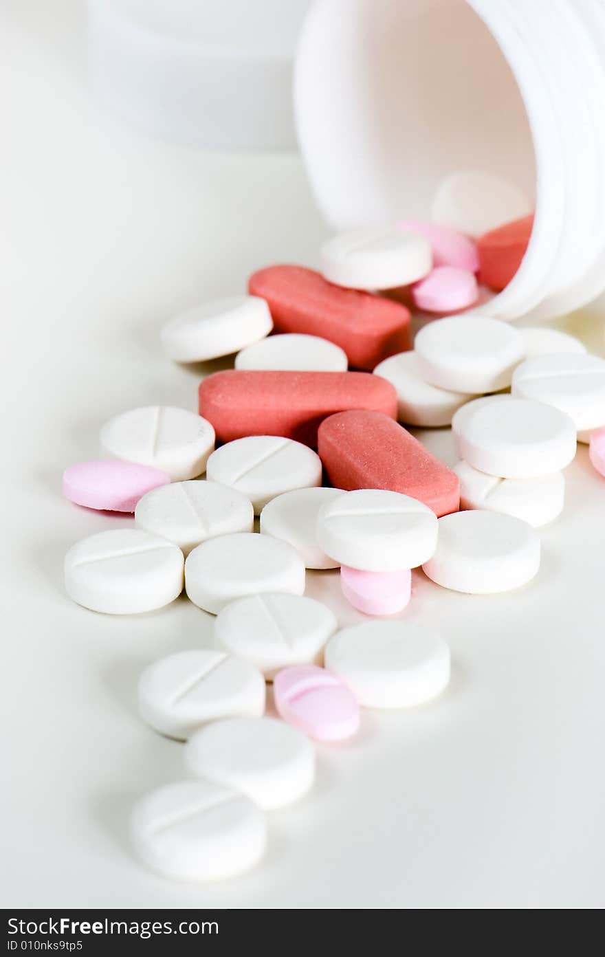 Close up of medicinal pills and container. Close up of medicinal pills and container