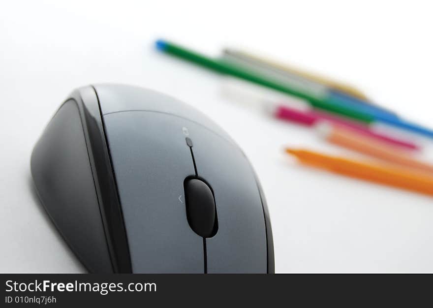 Closeup of computer mouse and colored pencils. selective focus. Closeup of computer mouse and colored pencils. selective focus