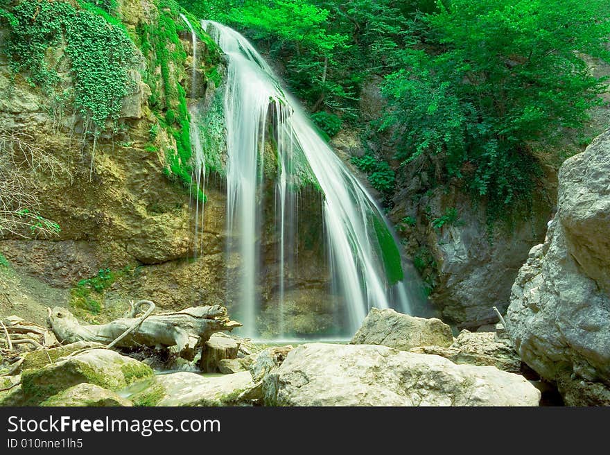 The well-known beautiful waterfall Djur Djur  in forest, Crimea, Ukraine. The well-known beautiful waterfall Djur Djur  in forest, Crimea, Ukraine