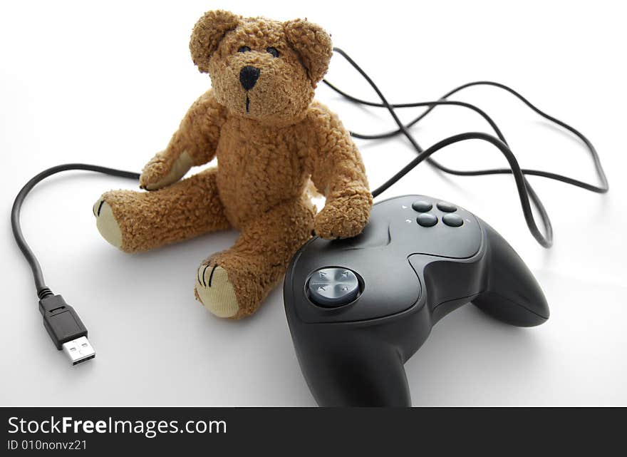 Closeup of game pad and teddy. selective focus. Closeup of game pad and teddy. selective focus