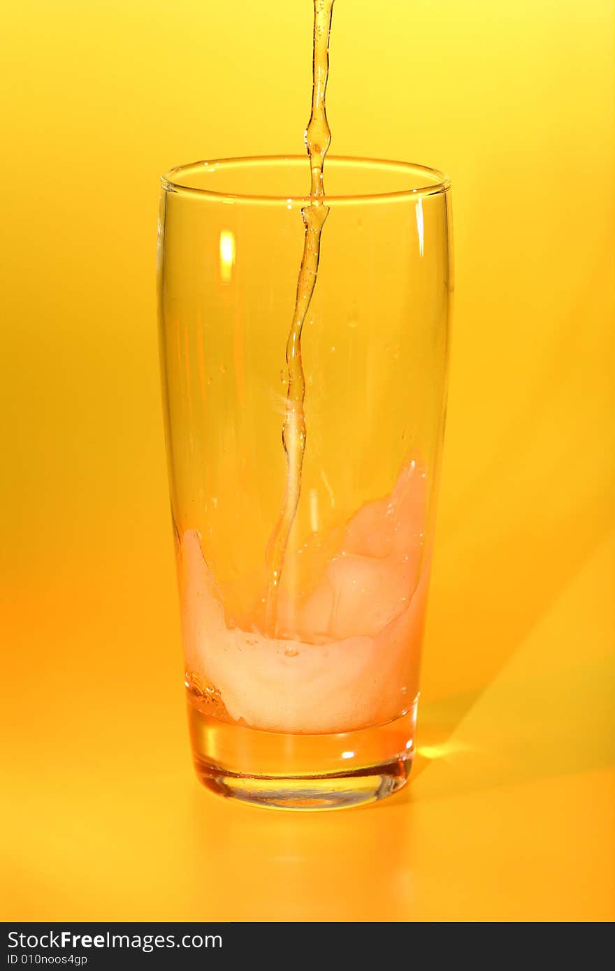 Glass of beer on a orange background. Glass of beer on a orange background.