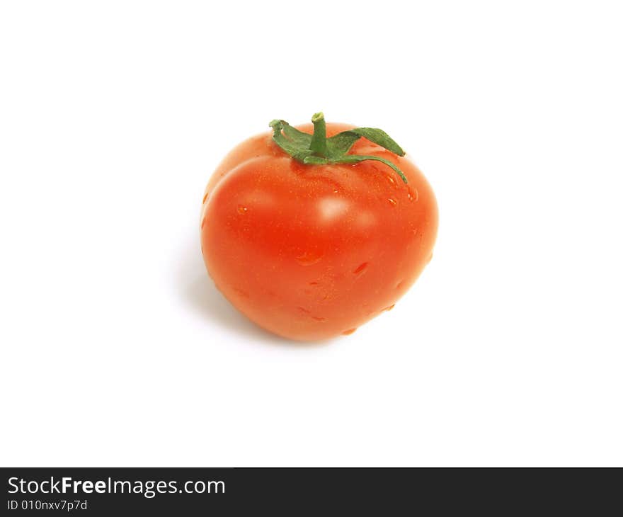 Fresh red tomato with water drops and isolated on white background. Fresh red tomato with water drops and isolated on white background