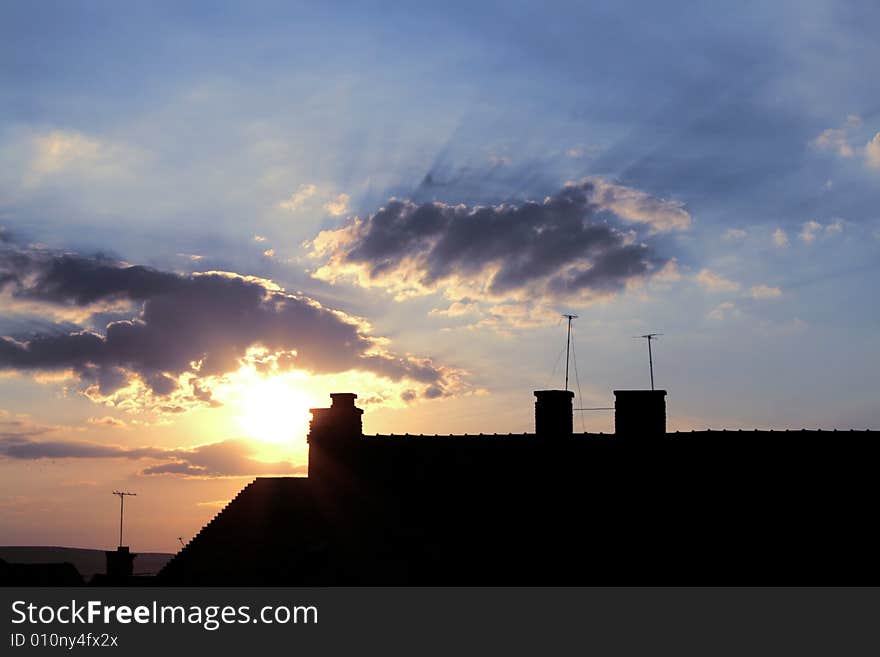 Urban sunrise with clouds and building