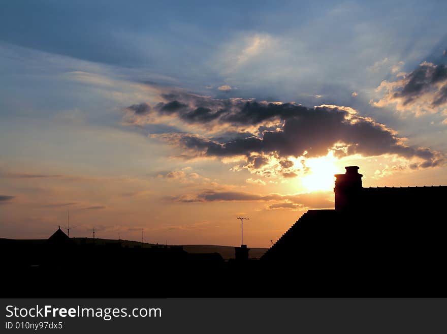 Urban sunrise with clouds and funnel. Urban sunrise with clouds and funnel