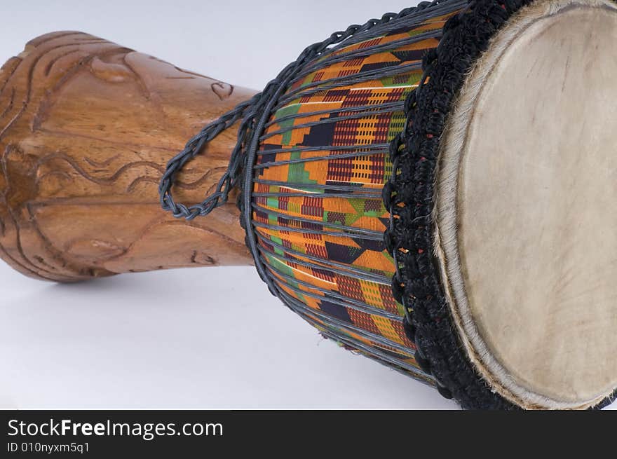 Close up of a Jemba drum with the typical bright colors of African tradition. Close up of a Jemba drum with the typical bright colors of African tradition.