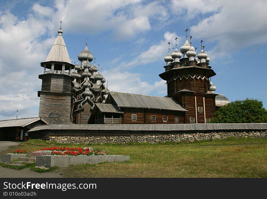 The museum of wooden architecture is located on the Kizhi island on Lake Onega in the Republic of Karelia, Russia. The Kizhi Pogost is the area inside the perimeter wall or fence and includes 2 large churches and a bell-tower.