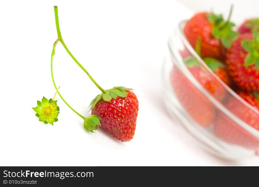 High key photo of fruit dish filled with nice red strawberries. High key photo of fruit dish filled with nice red strawberries