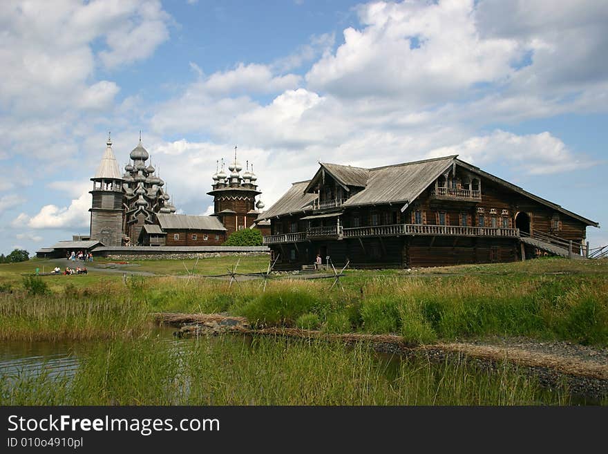 The museum of wooden architecture is located on the Kizhi island on Lake Onega in the Republic of Karelia, Russia. The Kizhi Pogost is the area inside the perimeter wall or fence and includes 2 large churches and a bell-tower.