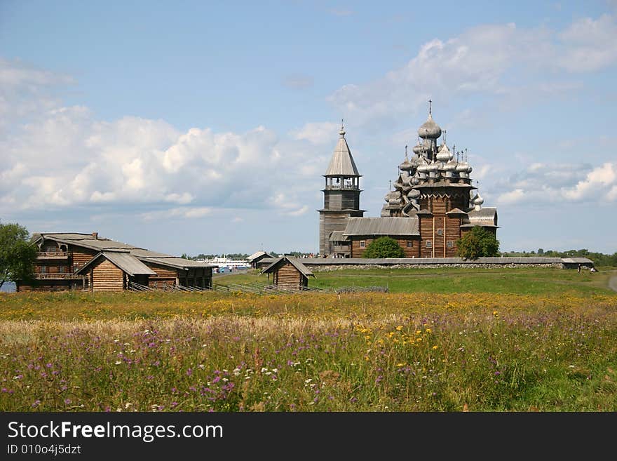 The museum of wooden architecture is located on the Kizhi island on Lake Onega in the Republic of Karelia, Russia. The Kizhi Pogost is the area inside the perimeter wall or fence and includes 2 large churches and a bell-tower.