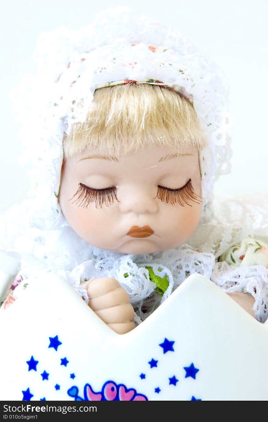 Baby doll on white background