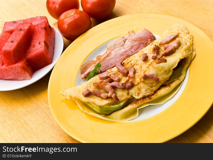 Fried Eggs With Bacon,melon And Tomato