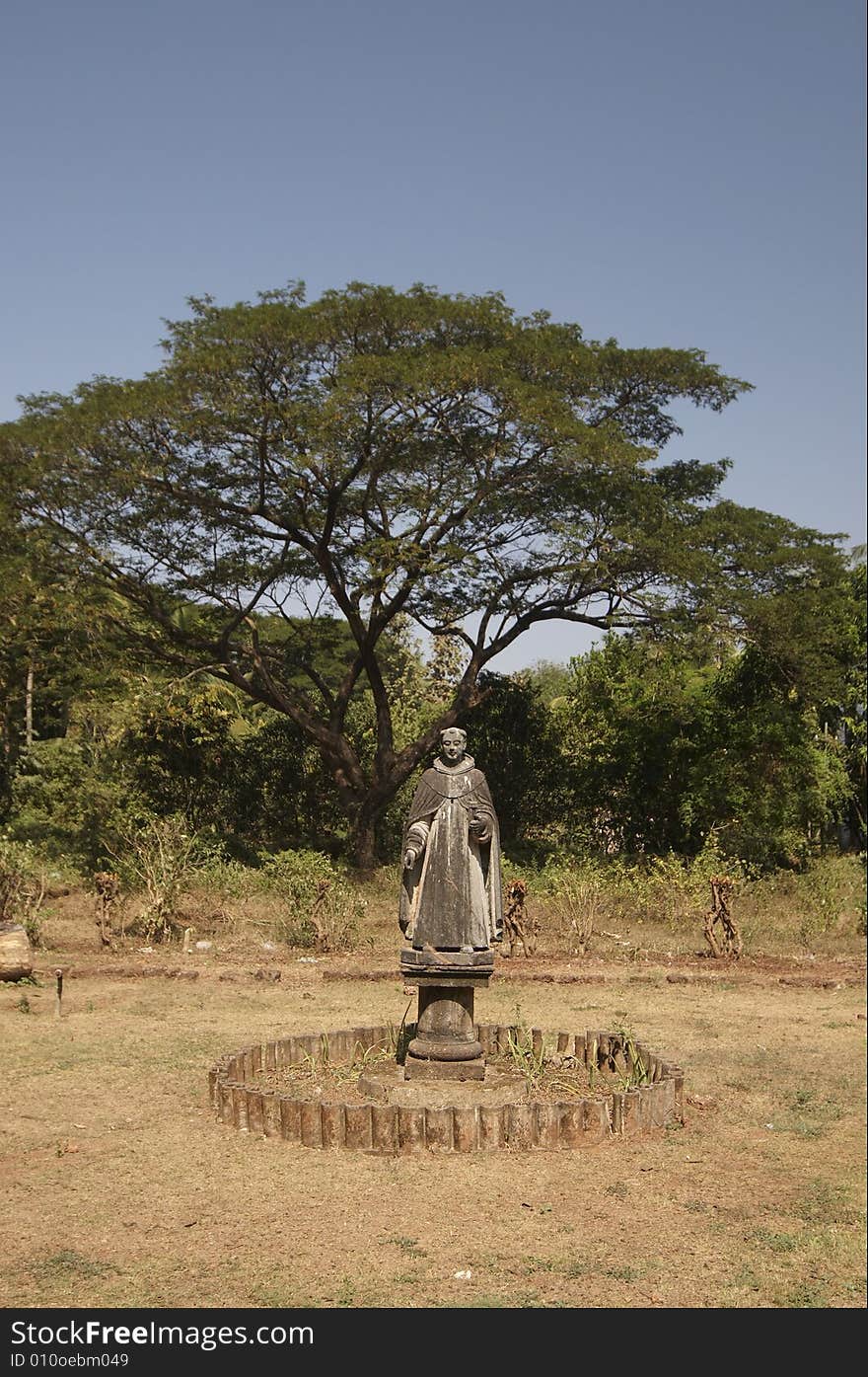 Monk`s sculpture. Inner yard of Church of St Cajetan. Old Goa, India.