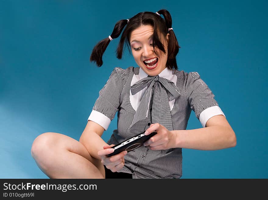 Young concentrated girl playing a game. Young concentrated girl playing a game.