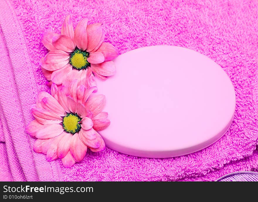 Spa essentials, soap, towel and flowers