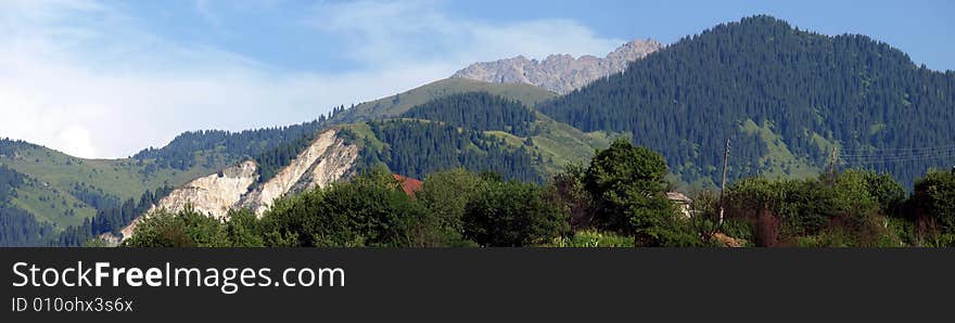 Panoramic Landscape Of Tien Shan Mountains