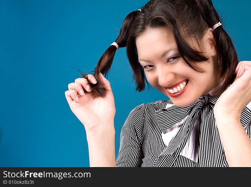 Young girl is happy with her two ponytails. Young girl is happy with her two ponytails