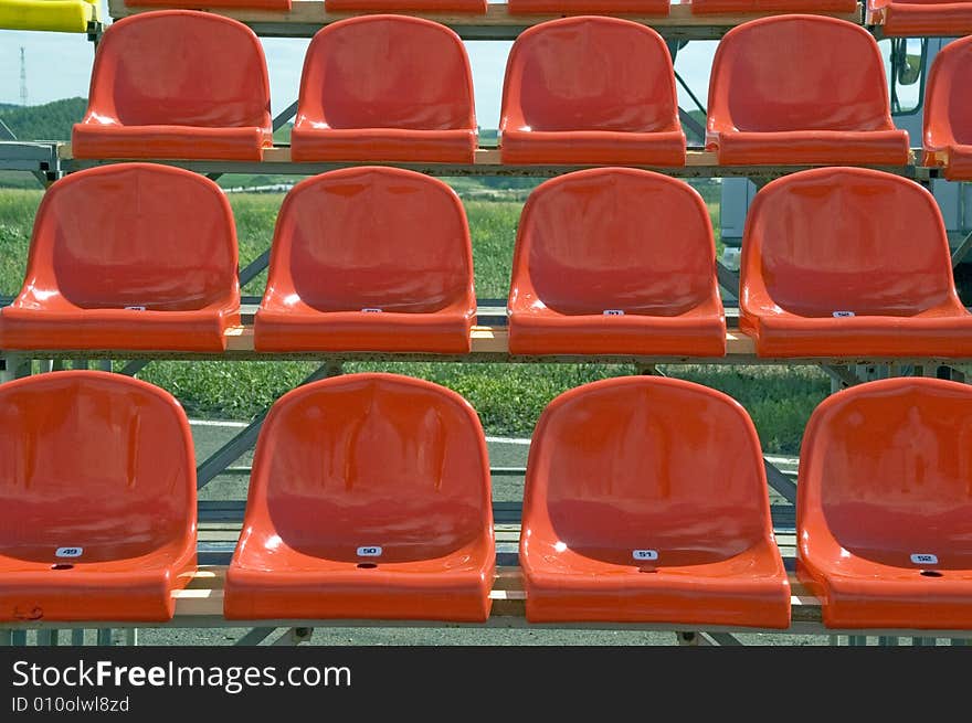 Lines of red seats.Red seats.