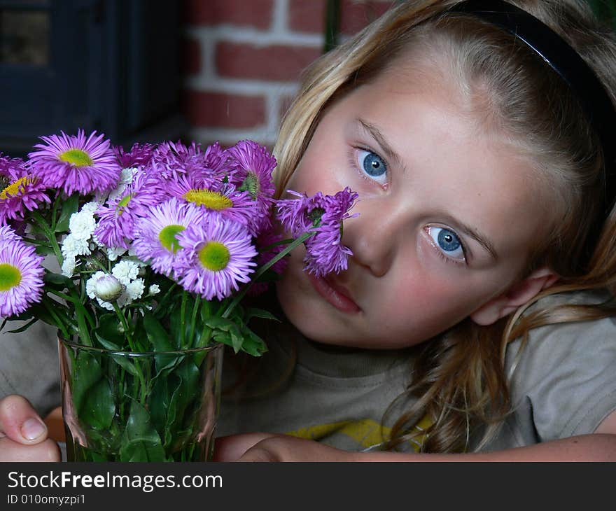 The boy with bunch of violet flower. The boy with bunch of violet flower.