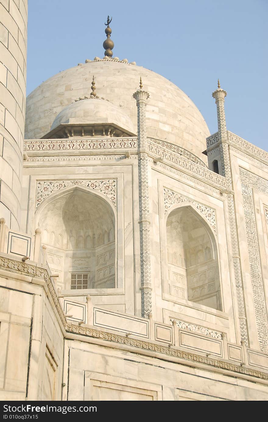 Upward Point of view of the Taj Mahal mausoleum in Agra, India showing the the primary dome as well as a corner dome and the edge of the minaret to form a side border. Upward Point of view of the Taj Mahal mausoleum in Agra, India showing the the primary dome as well as a corner dome and the edge of the minaret to form a side border