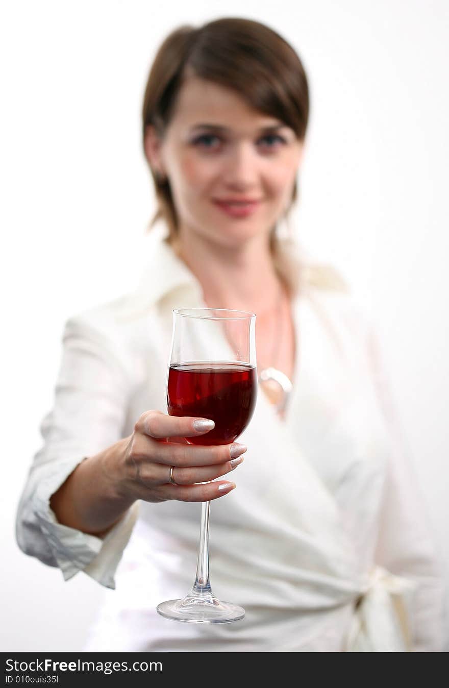 Beautiful girl with glass of red wine on white background.