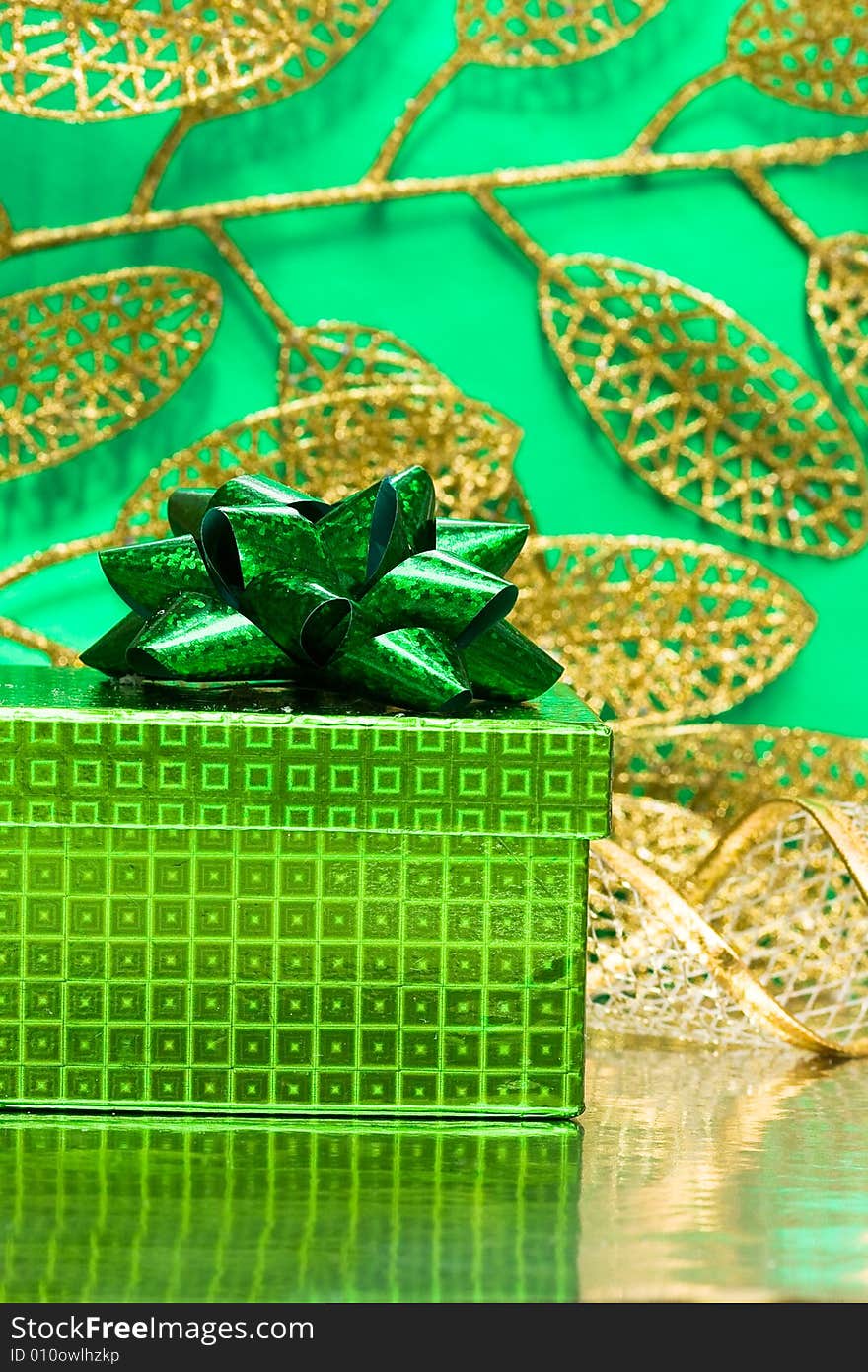 Gift box on green background with leaf