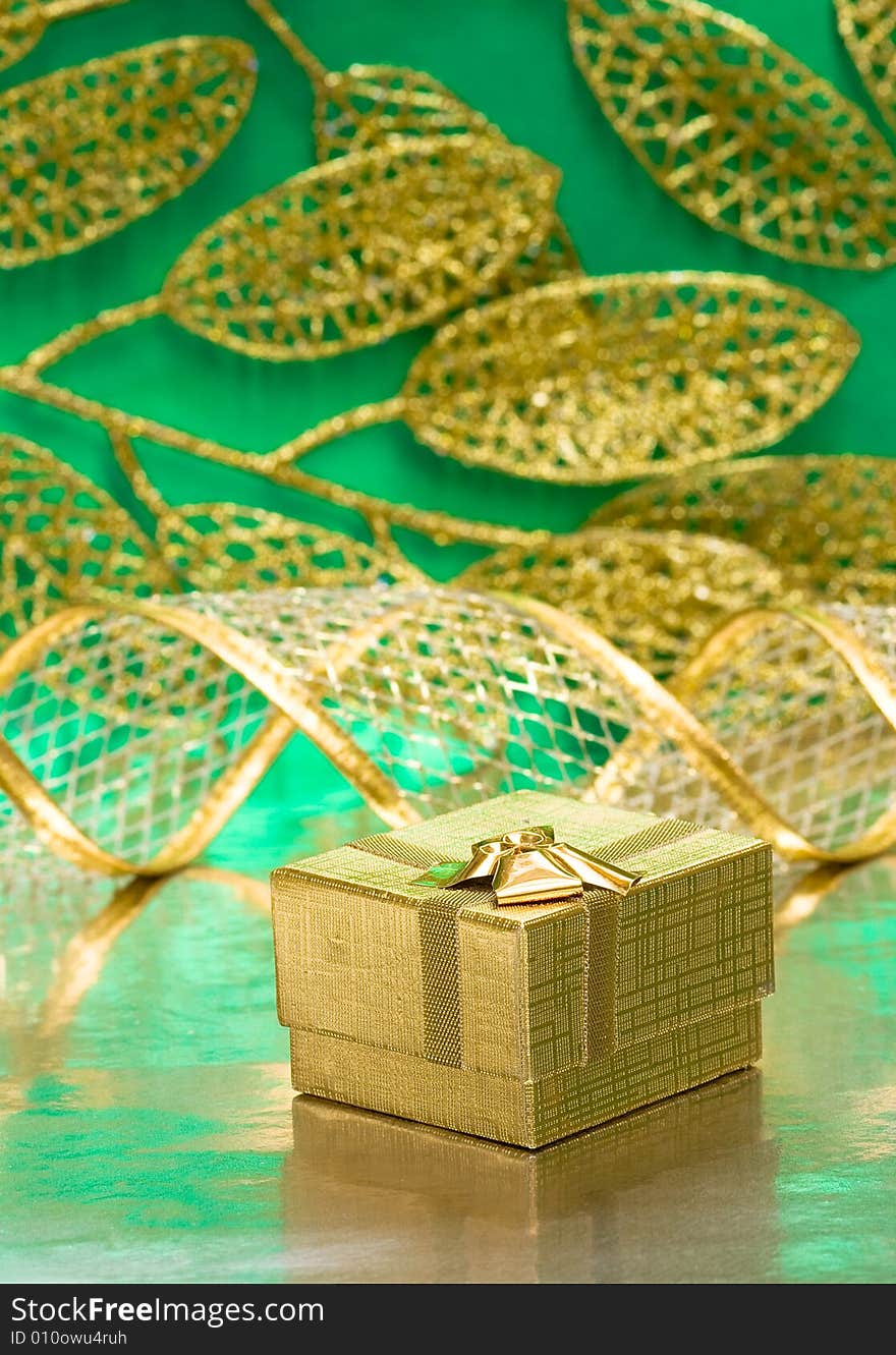 Golden gift box with leaves