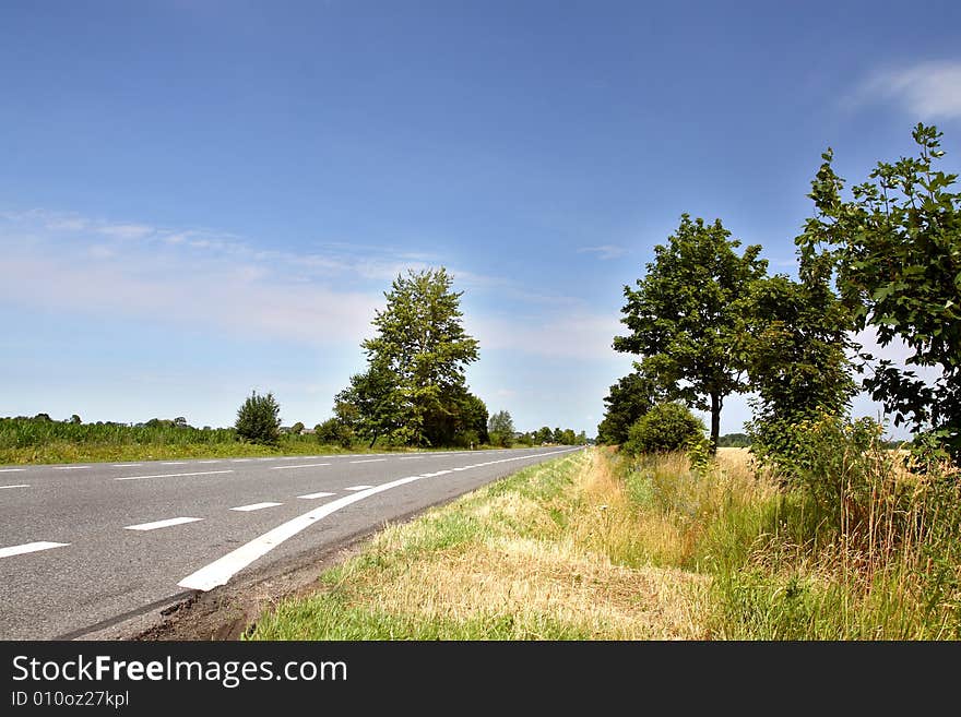 Countryside road with blue sky in backround