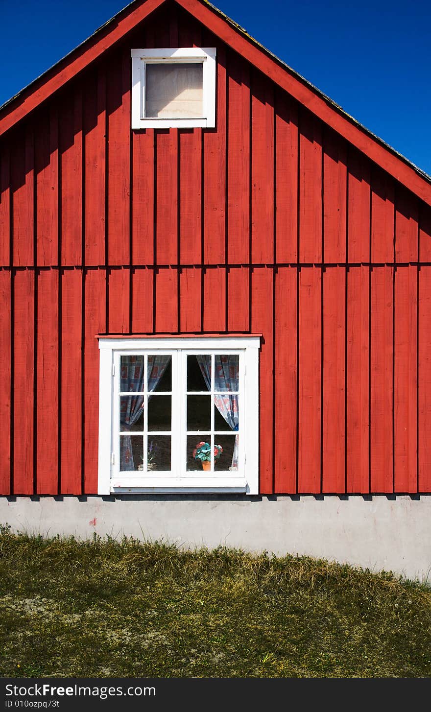 Facade of a vivid red cottage (Sweden)