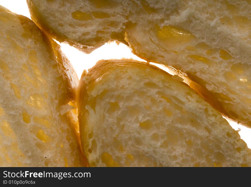 Slices of bread on light background. Slices of bread on light background