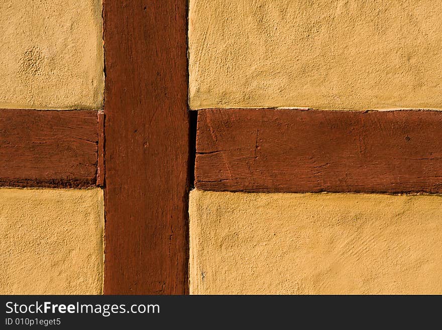 Wooden cross in a yellow wall (Sweden). Wooden cross in a yellow wall (Sweden)