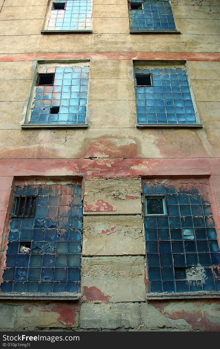 An old textured wall with windows in perspective. An old textured wall with windows in perspective