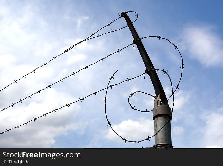 Three lines of barbed wire. Three lines of barbed wire