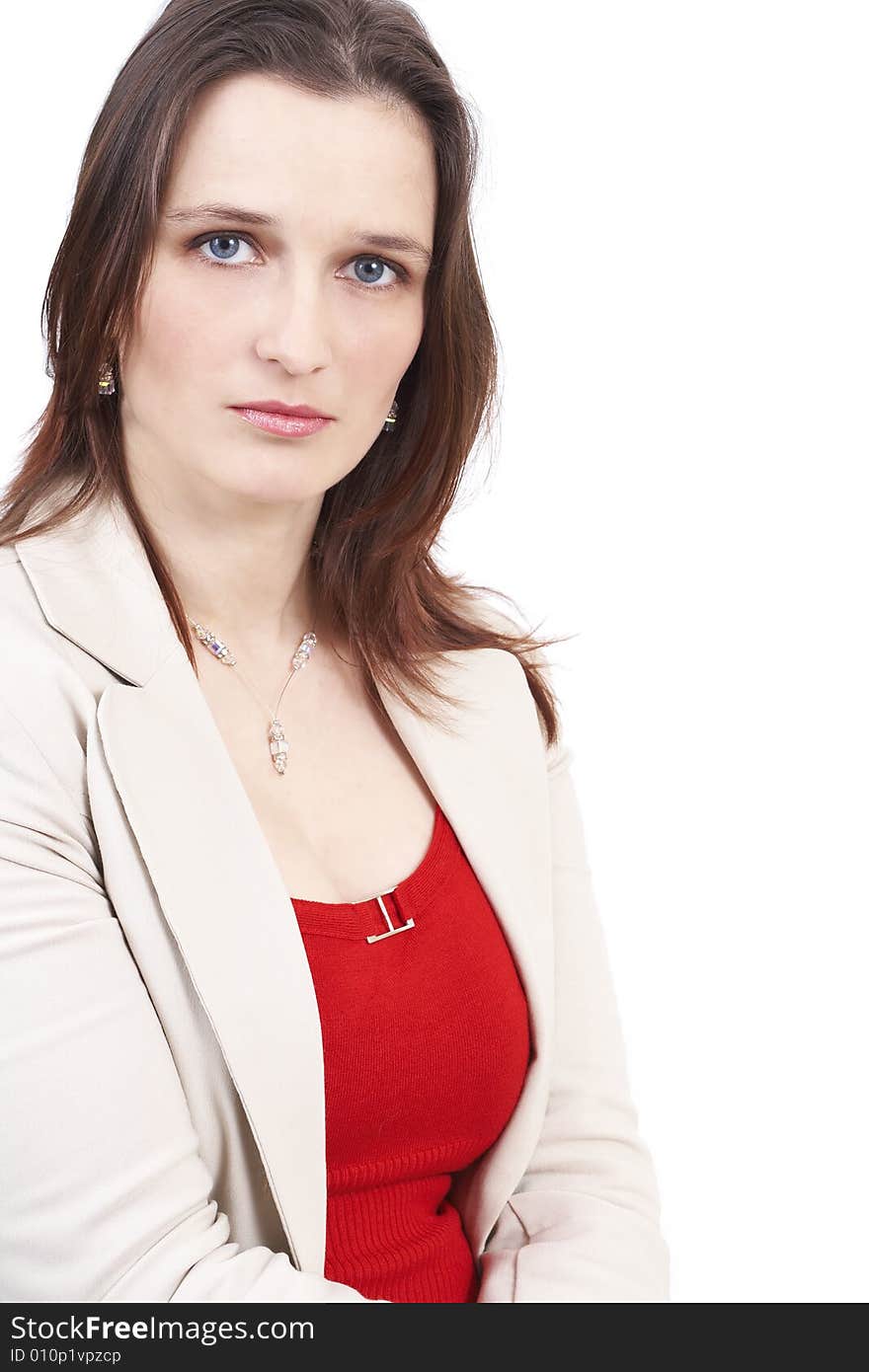 Beautiful brunette businesswoman wearing a beige jacket and a red top. Isolated on white background with copy space