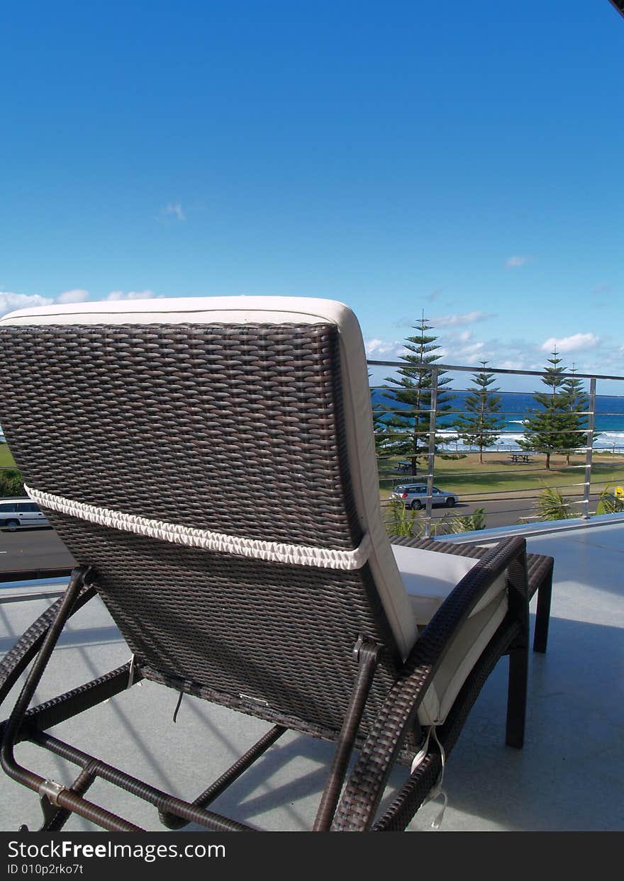 Chair on balcony with ocean view