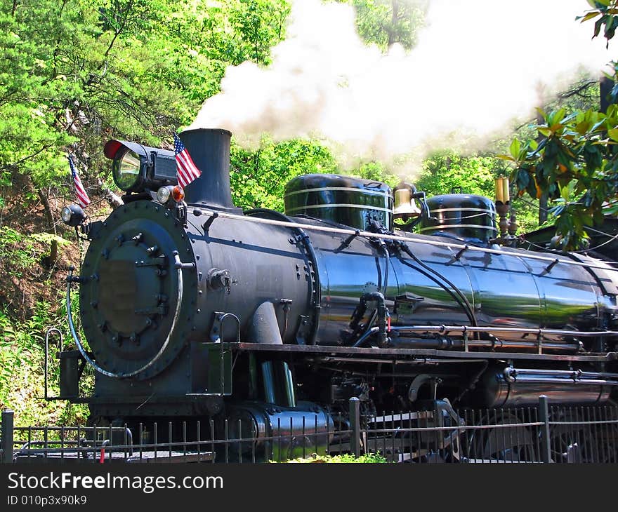 A vintage steam engine used in WWII taking off from the station. A vintage steam engine used in WWII taking off from the station.