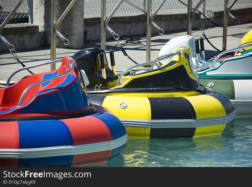 A boat ride where riders squirt water on each other in a pool. A boat ride where riders squirt water on each other in a pool.